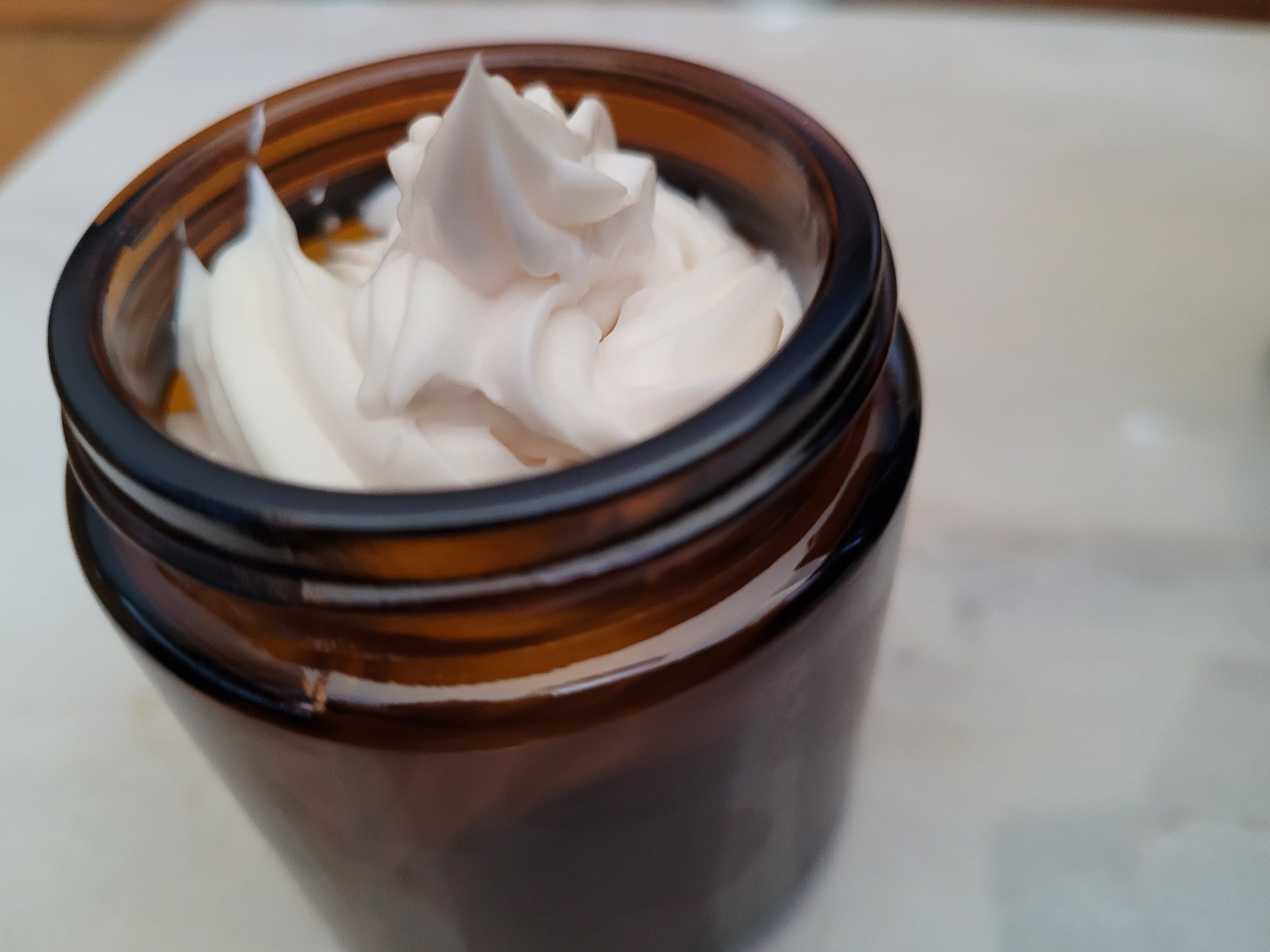 Brown jar with white cream on a light background, Cowgirl & Cowboy Body Butter Rich Wellness TX 